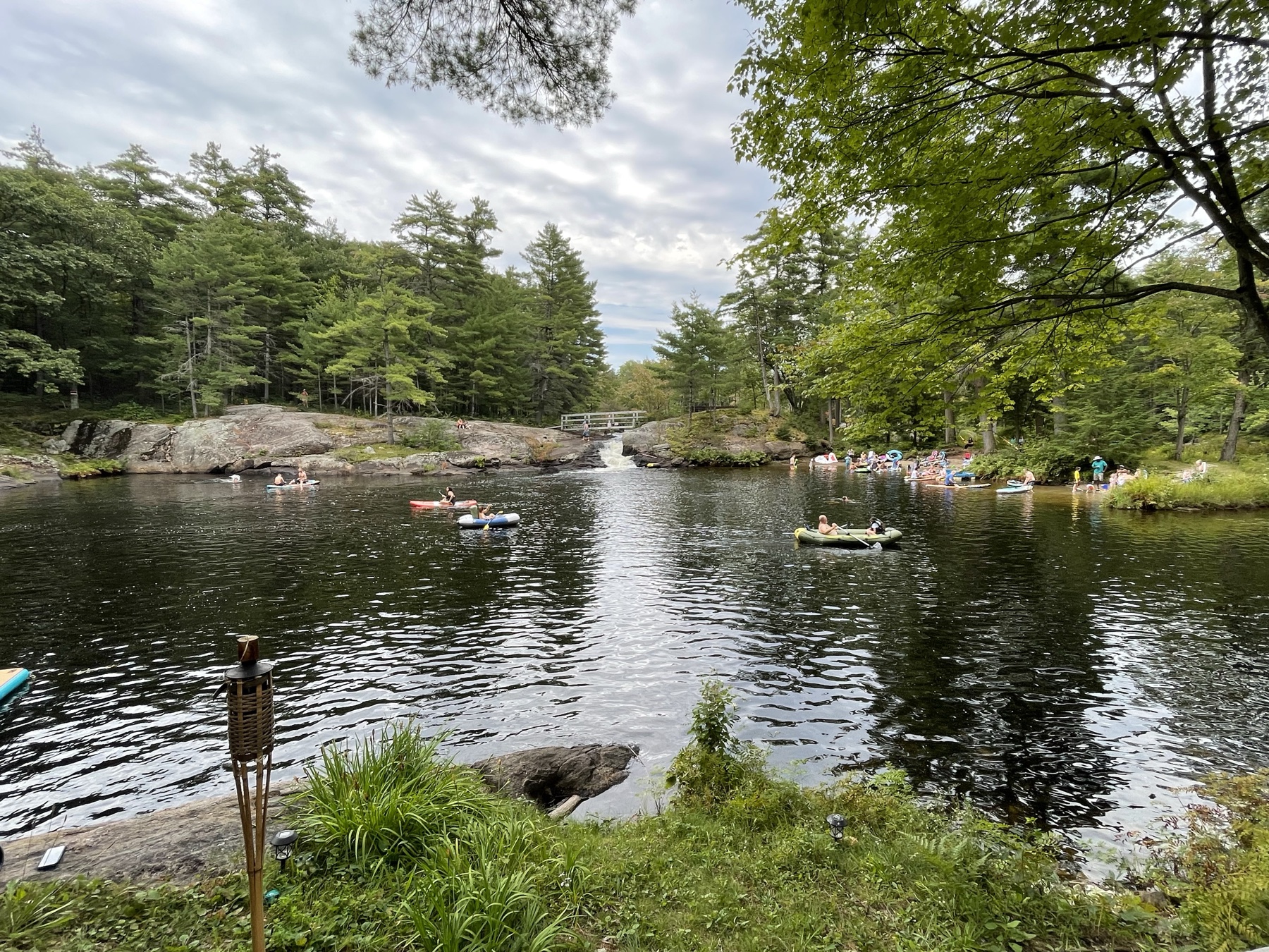 Families enjoying the river on a summer day